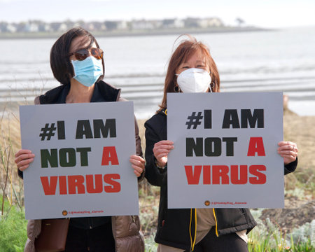 Alameda, CA - March 24, 2021: Unidentified participants at a youth lead anti-Asian Violence March,...