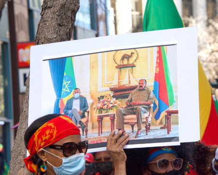 San Francisco, CA - Mar 26, 2021: Unidentified participants chanting and marching up Market Street at a Call to Action for defense of Ethiopia and Eritrea protestのeditorial素材