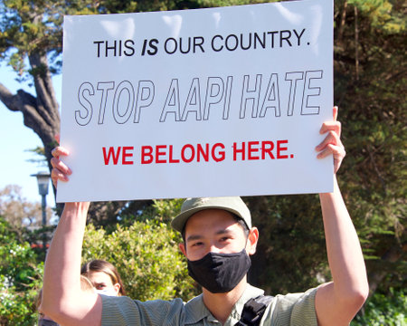 Berkeley, CA - Mar 28, 2021: Unidentified participants at Asian American Pacific Islander Youth Rising Rally marching from Aquatic park to the pedestrian 80 freeway over pass. Anti Asian Hate Rally.のeditorial素材