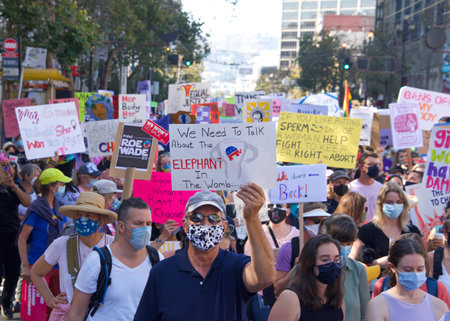 San Francisco, CA - Oct 02, 2021: Unidentified participants in the Women's March for Reproductive Rights holding signs marching down down Market Street in San Francisco.のeditorial素材