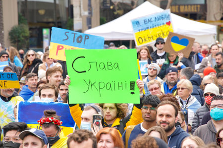 San Francisco, CA - Feb 26, 2022:  Unidentified participants at United We Stand For Ukraine Protest holding signs. Advocating for solidarity with the people of Ukraine against Russian aggression.のeditorial素材