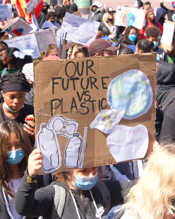 San Francisco, CA - April 22, 2022: Unidentified participants of Youth lead climate strike marching...