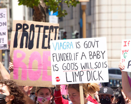 San Francisco, CA - May 7, 2022: Unidentified Participants holding signs marching in San Francisco at Womenâs Rights Protest after SCOTUS leak plan to overturn Roe v Wade.のeditorial素材