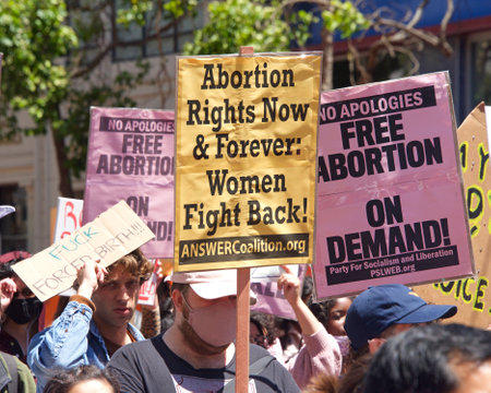 San Francisco, CA - May 7, 2022: Unidentified Participants holding signs marching in San Francisco at Womenâs Rights Protest after SCOTUS leak plan to overturn Roe v Wade.のeditorial素材