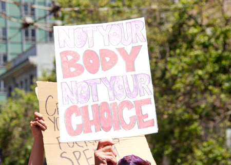 San Francisco, CA - May 7, 2022: Unidentified Participants holding signs marching in San Francisco at Womenâs Rights Protest after SCOTUS leak plan to overturn Roe v Wade.のeditorial素材