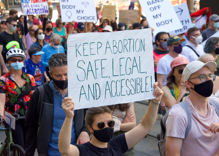 San Francisco, CA - May 14, 2022: Unidentfied participants marching in the streets holding signs in support of Reproductive Justice and a Womanâs Right to Choose.のeditorial素材