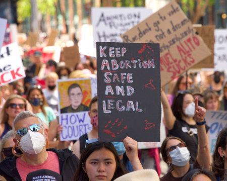 San Francisco, CA - May 14, 2022: Unidentified participants marching in the streets holding signs in support of Reproductive Justice and a Womanâs Right to Choose.のeditorial素材