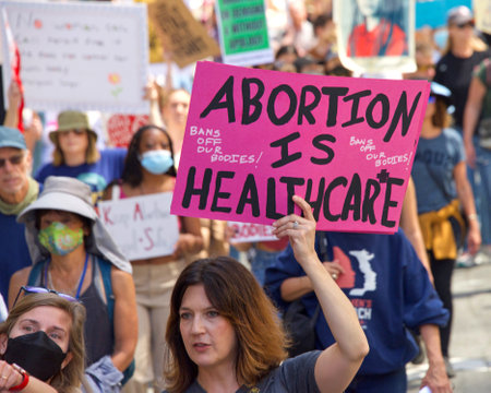San Francisco, CA - May 14, 2022: Unidentfied participants marching in the streets holding signs in support of Reproductive Justice and a Womanâs Right to Choose.のeditorial素材