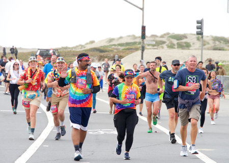 San Francisco, CA - May 15, 2022: Participants in the annual Bay to Breakers race on Great Hwy coming to the finish line. Bay to Breakers is well known for many participants wearing fun costumes.のeditorial素材