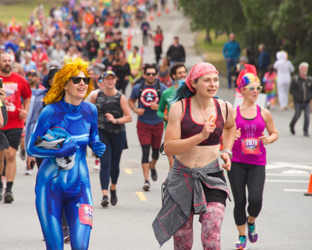 San Francisco, CA - May 15, 2022: Unidentified participants in the annual Bay to Breakers race through Golden Gate park. Bay to Breakers is well known for many participants wearing fun costumes.のeditorial素材