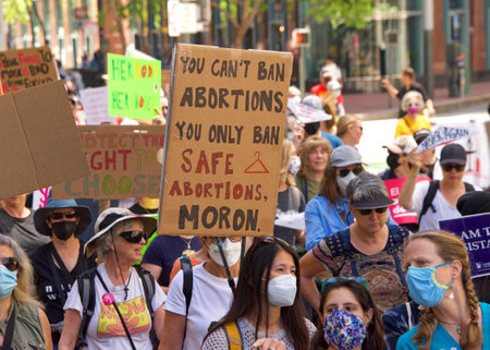 San Francisco, CA - May 14, 2022: Unidentfied participants marching in the streets holding signs in support of Reproductive Justice and a Womanâs Right to Choose.のeditorial素材