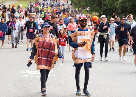 San Francisco, CA - May 15, 2022: Unidentified participants in the annual Bay to Breakers race through Golden Gate park. Bay to Breakers is well known for many participants wearing fun costumes.のeditorial素材