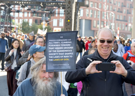 San Francisco, CA - Jan 15, 2024: Participants in Martin Luther King March walking from Caltrain station down 4th St over the bridge then up 3rd St over the bridge to Yerba Buena Garden.のeditorial素材
