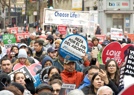 San Francisco, CA - Jan 20, 2024: Thousands of participants in the annual March for Life, holding pro-life signs and banners, walking down Market street towards the Embarcadero.のeditorial素材