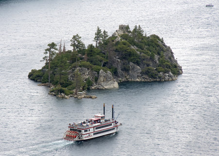 Emerald Bay, CA - July 20, 2024: MS Dixie II cruising Emerald Bay on a cloudy day. Based in Nevada, tours are offered daily.のeditorial素材