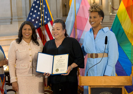 San Francisco, CA - August 01, 2024: Mayor London Breed presenting an award to Nicky Tita Aida Calma at a press event to kick off San Franciscoâs 3rd Annual Trans History Month.のeditorial素材