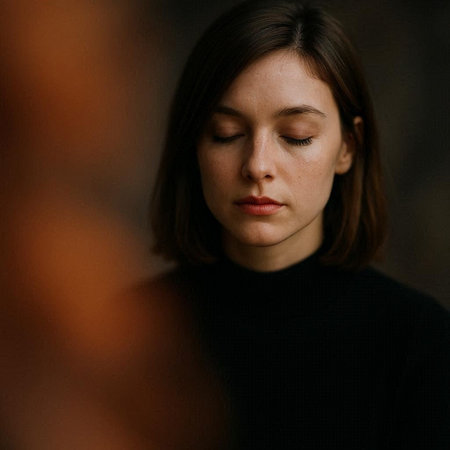 portrait of a girl in a black sweater on a dark background
