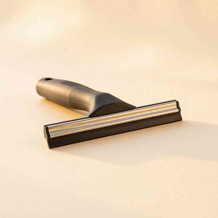 Shaving razor on a beige background. Close-up.