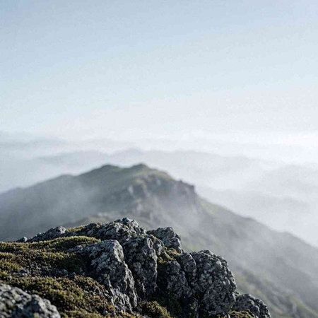 Mountain landscape with fog in the morning. View from the top of the mountain.