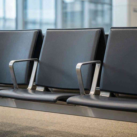 Waiting area at the airport. Row of chairs in airport terminal.