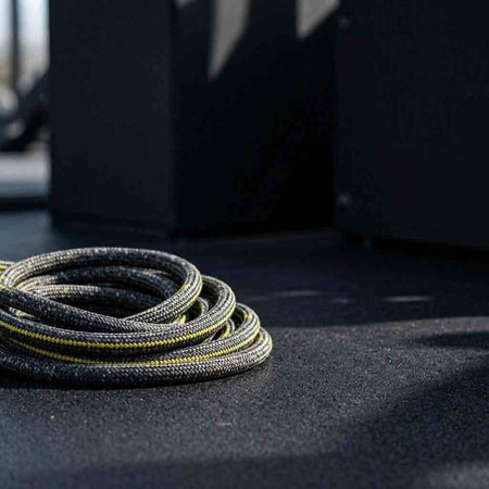 A closeup shot of a rope on a black background with copy space