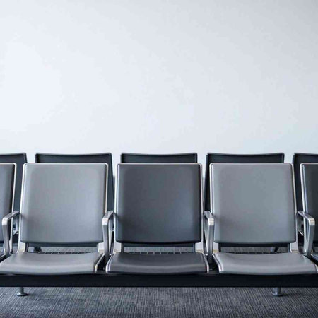 Empty chairs in the waiting room of a modern airport. 3d rendering