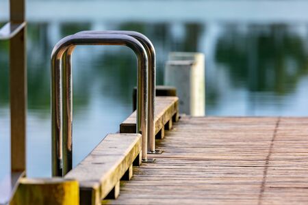 A Stainless Steel Ladder Leads to the Water. Sunrise On the Jetty