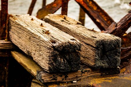 Rustic Wooden Posts and Rusty Metal Rot Away by the Ocean