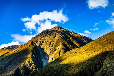 A Rocky Mountain Peak Stands Tall and Reaches to the Skyの写真素材