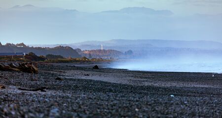 Sunrise on a West Coast Beach as the South Island in  New Zealand Awakensの写真素材