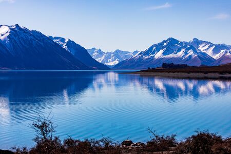 A Gorgeous Day at Lake Tekapo Facing the Sourthern Alps in New Zealandの写真素材