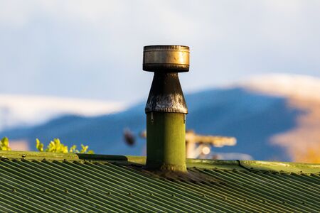 An Old Chimney Is  About To Start Smoking As THe Day Cools Off In Twizel, New Zealand, In Spring....