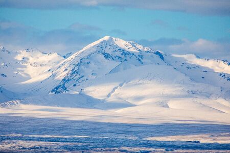Springtime Snowfall On The Hills Over Lake Pukaki In New Zealand's Canterburyの写真素材