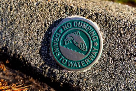 No Dumping, Drains To Waterway. A Symbol Found In Califorina's Big Surの写真素材