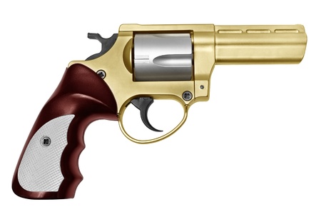 Revolver of gold color and ruby color a handle  It is isolated on a white background の写真素材
