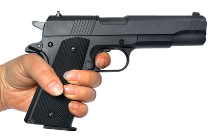 Pistol in a hand it is isolated on a white backgroundの写真素材