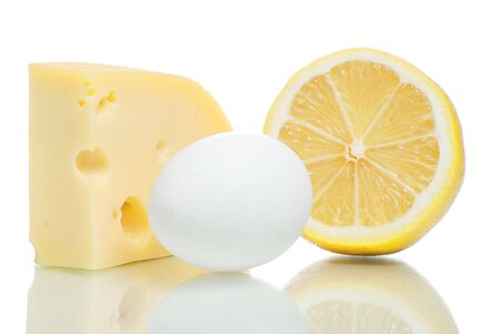 Cheese, egg and lemon. Isolated on white background.の写真素材