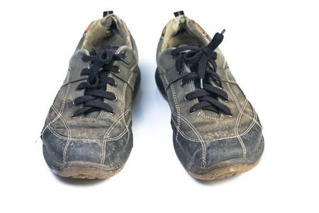 Old sports shoes. Isolated on white background.の写真素材