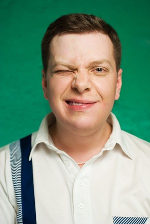 Portrait of the man on green background.の写真素材