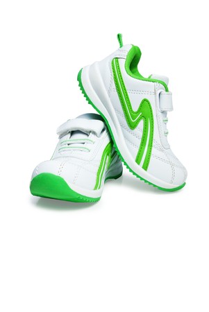 Kid`s sport shoes. Isolated on white background の写真素材