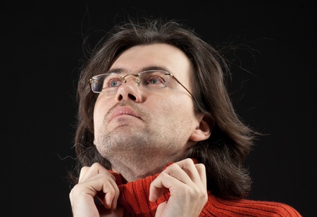 Portrait of handsome long hair man in red sweaterの写真素材