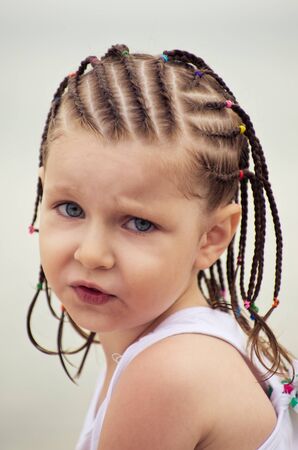Portrait of little girl with dreadlocks on the beachの写真素材