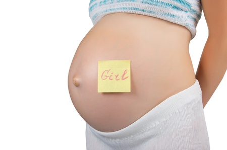 Pregnant woman with a sticky note on her bellyの写真素材