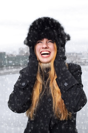 Young caucasian beautiful  redhead  woman against urban background.の写真素材