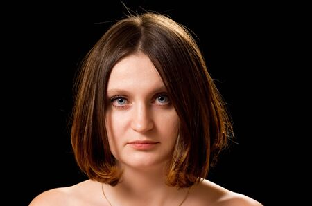 Beautiful caucasian woman with fashion bob haircut. Isolated on black background.の写真素材