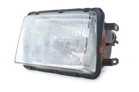 Used headlamp as repair part. Isolated on white background.の写真素材