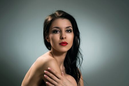 Portrait of beautiful naked brunette.