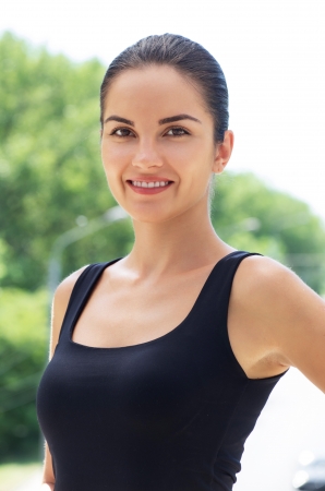 Beautiful caucasian brunette young woman against natural green background..の写真素材