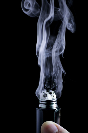 E-cigarette vape. Isolated against black background.