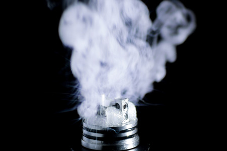 E-cigarette vape. Isolated against black background.